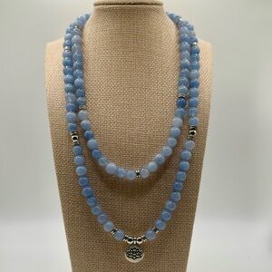 Elegant Blue Beaded Necklace with Silver Accents & Lotus Pendant